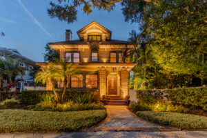 2 story traditional home with landscape lighting